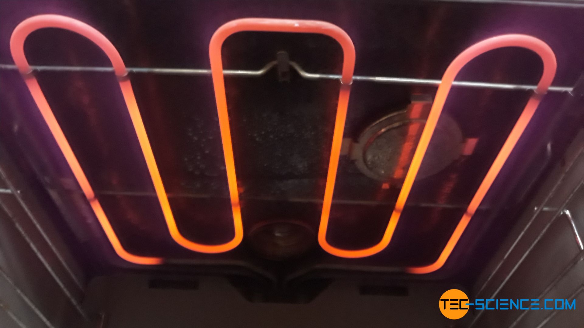 Red glow of the heating element of an oven